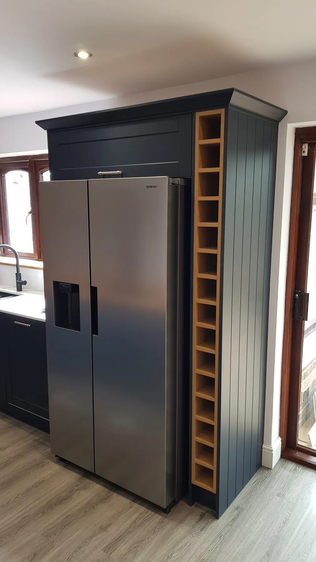 Finished tall kitchen cabinetry