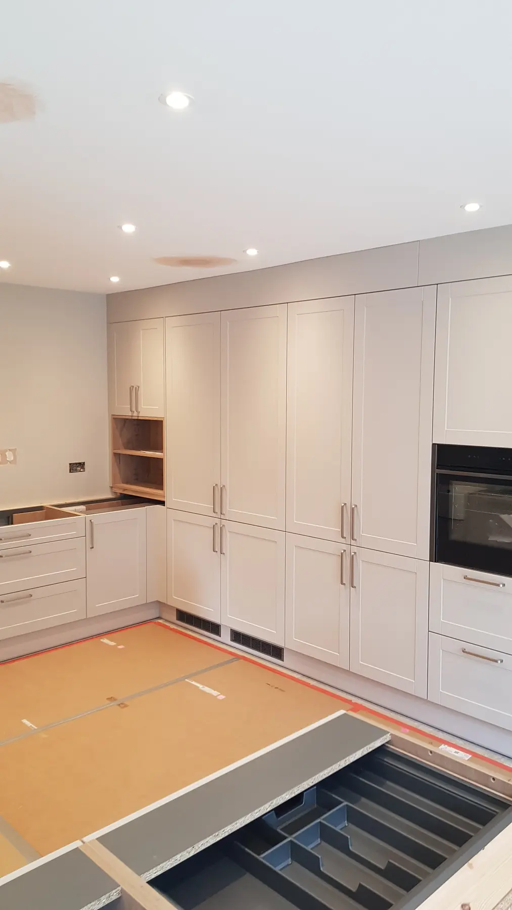 Kitchen cabinetry installation in progress