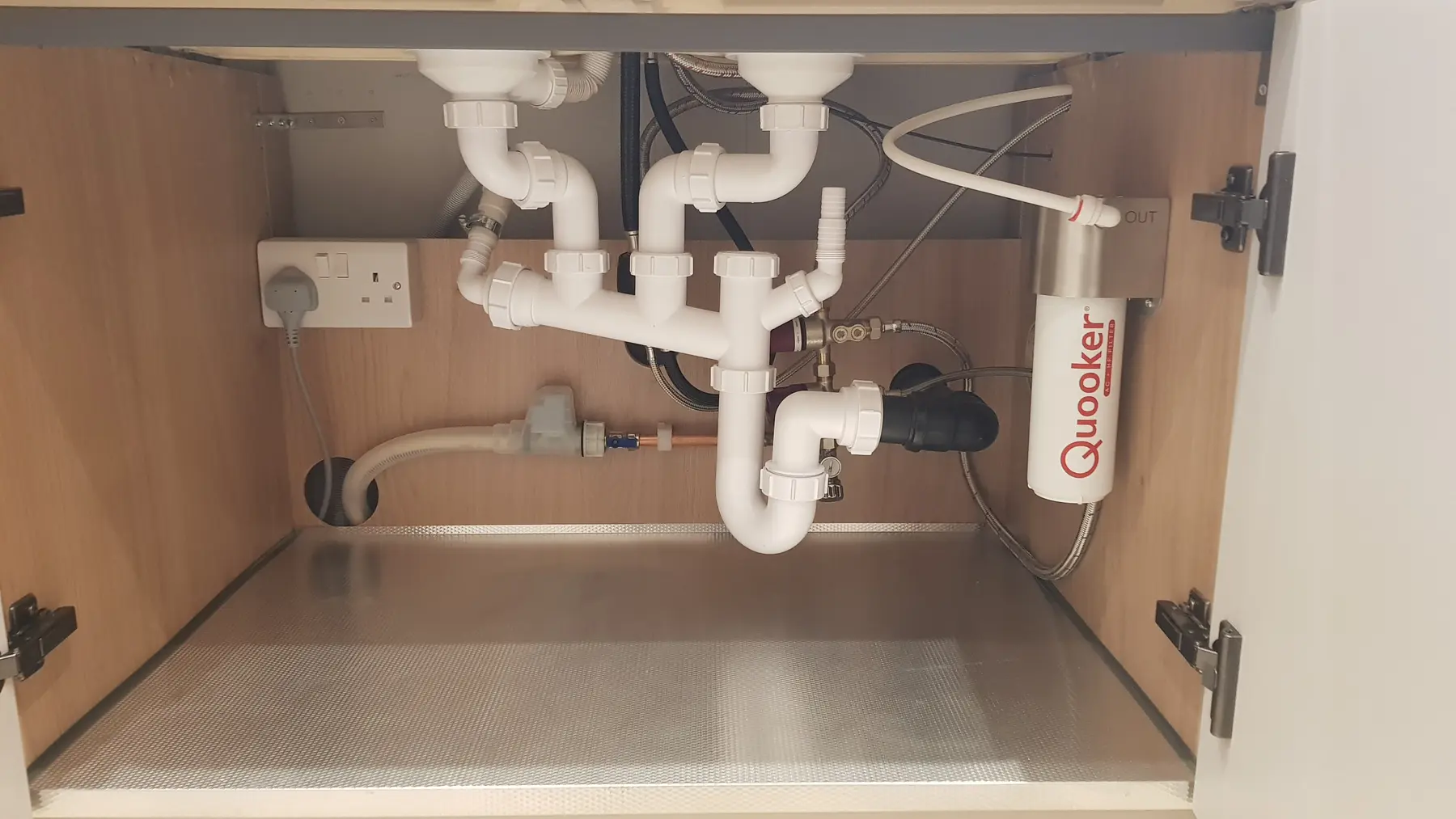 Plumbing below the kitchen sink