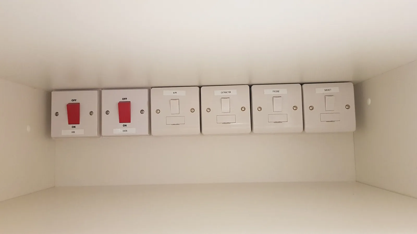 Appliance switches inside cabinetry
