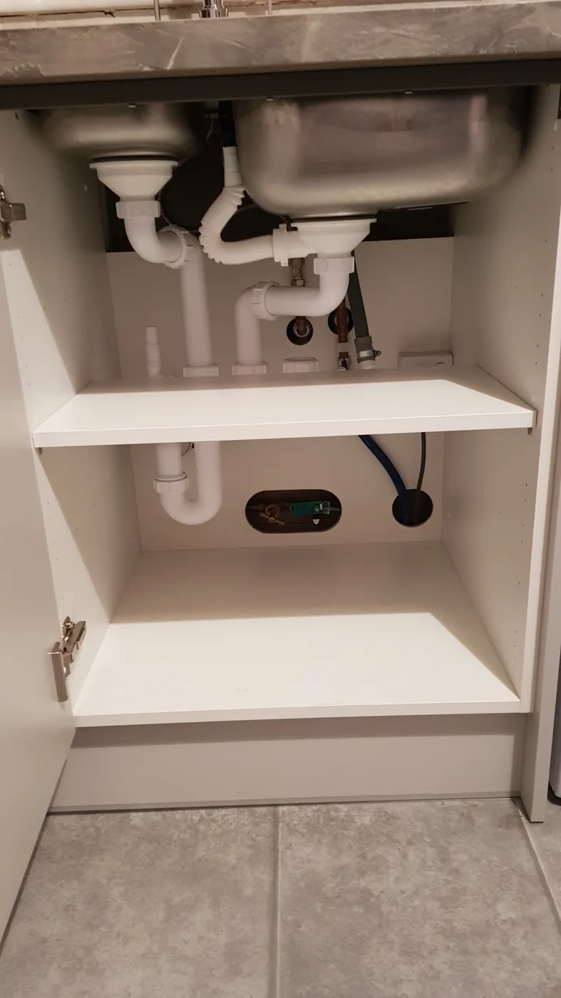 Under-sink shelving and pipework